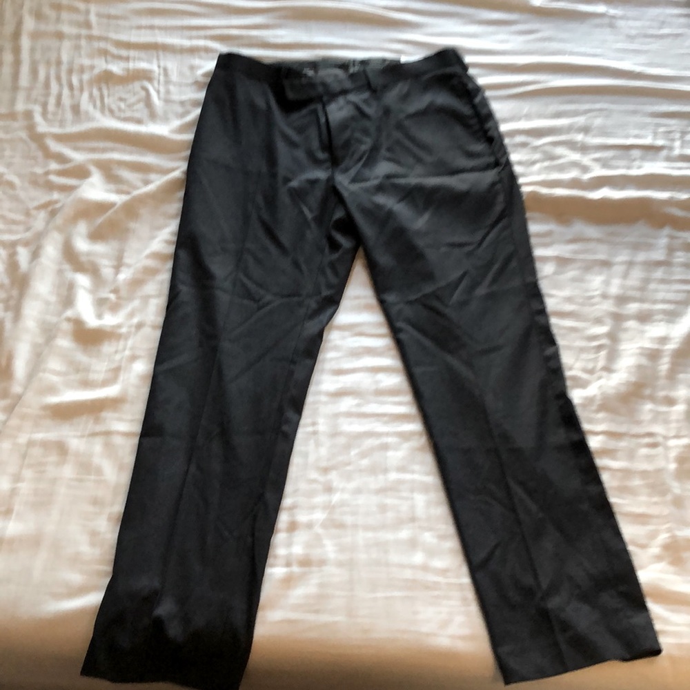 Never worn Calvin Klein Navy slim fit dress pants. 34W 30L.